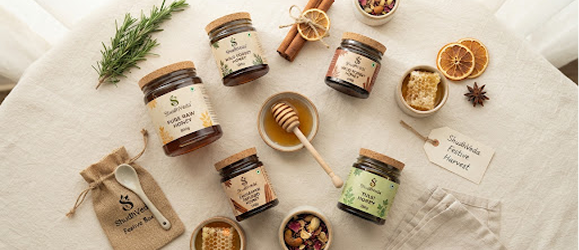 Flatlay of honey jars and ingredients